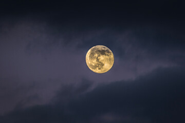 Naklejka na ściany i meble Full Moon December 2020, the last full moon of the decade, rising over mountain at dusk