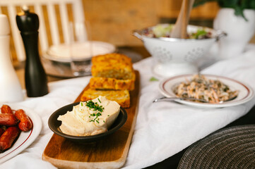 Freshly backed bread placed on a table ready to be served with butter