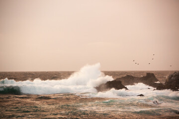 Waves crashing onto a rocky shore