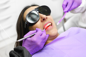 Dentist Using A Modern Diode Dental Laser. High quality photo