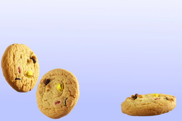 Fototapeta na wymiar traditional homemade healthy tea time snack oatmeal cookies with flying or falling cookies with copy space