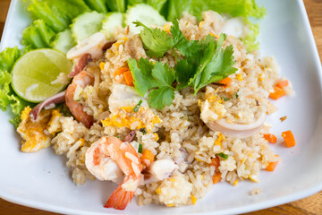 Shrimp fried rice on a wooden table from a top view