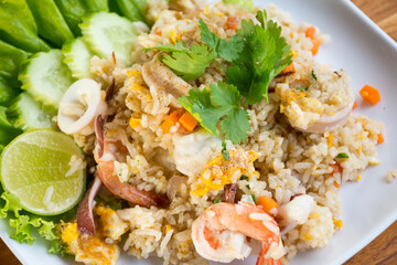 Shrimp fried rice on a wooden table from a top view