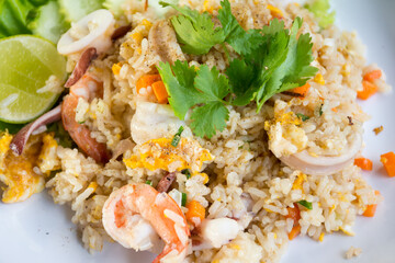 Shrimp fried rice on a wooden table from a top view