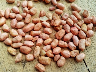 peanuts on a wooden plank background