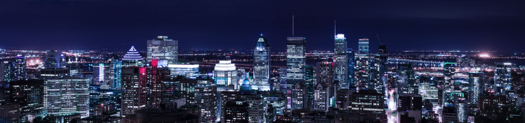 Montreal panorama skyline at night. Office buildings and skysrcapers of Canadian city. Amazing panorama view of night illuminated town in Quebec Province.