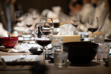 Fototapeta na wymiar Wine glasses on the table in a fine restaurant at night