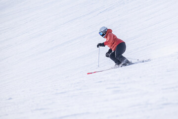 People are having fun in downhill skiing and snowboarding	