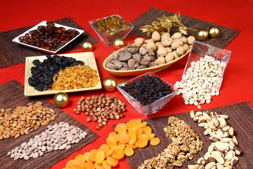 Different nuts and dried fruits in different and colorful pots