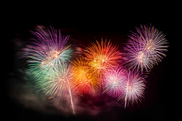 celebration happy new year and merry christmas funcy colorful firework on isolated black background