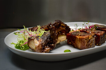 Beef brisket with ribs with wine sauce and microgreen