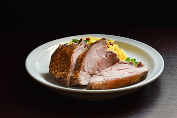 baked turkey thigh with rice garnish
