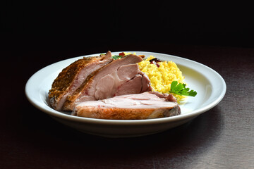 baked turkey thigh with rice garnish
