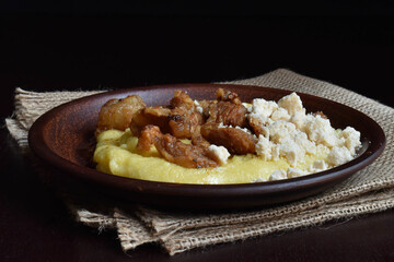 Banush, corn grits porridge with feta cheese and cracklings
