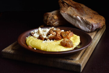 Banush, corn grits porridge with feta cheese and cracklings
