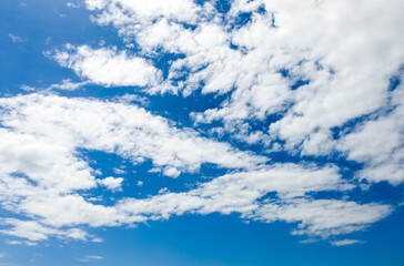 Bright blue sky background and white clouds