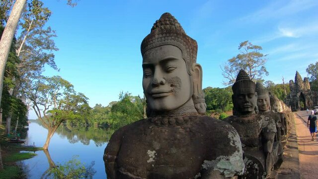 Stone carved statues of Devas on the bridge to Angkor Thom at Siem Reap, Cambodia