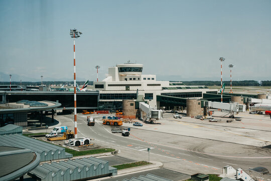 Italy, Milan, July 12, 2019: Airplanes and flight control center and other architecture at the Malpensa Airport in Milan.