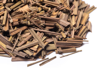 Organic dried lemongrass, latin name cymbopogon citratus heap close-up view on white background
