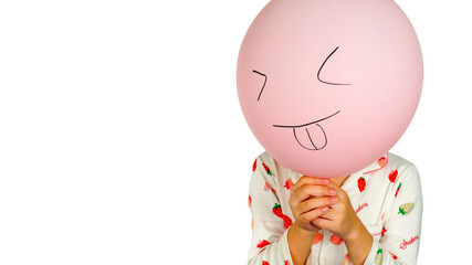 A pink balloon with a hand drawn picture of a happy, funny smiling face and a girl holding it. Isolated on white background. Copy space.
