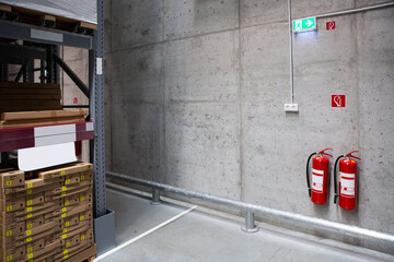 Fire extinguishers in the warehouse. Fire safety	
 - obrazy, fototapety, plakaty
