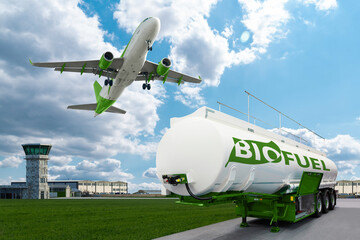 Airplane and biofuel tank trailer on the background of airport. New energy sources	 - obrazy, fototapety, plakaty