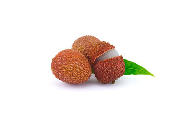 Lychee fruit whole and opened with green leaves