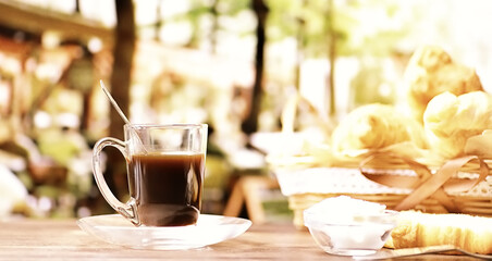 Fresh pastries on the table. French flavored croissant and coffee.