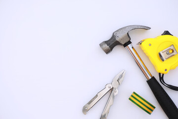 Top view of Set of construction and maintenance tooling for handyman on white concrete background with copy space