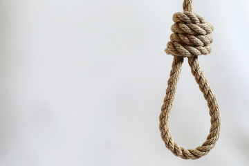 Braided thick rope tied in a skein. Hemp rope for decoration and design. Background from a fishing rope.