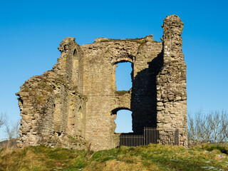 Ruins of Medieval 11th century Clun Castle in England, UK, built by William the Conqueror and view over Shropshire Hills