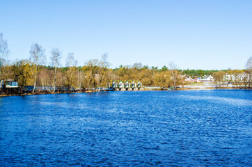 Fototapeta na wymiar landscape of blue lake near forest