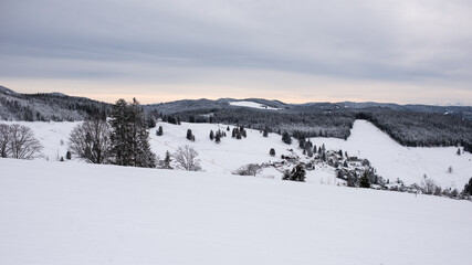 winter landscape in the black forest in germany, view over the village todtnauberg.