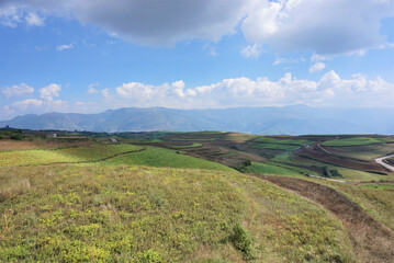 Dongchuan Red Earth Multi-Colored Terraces - Red Soil, Green Grass, Layered Terraces