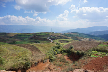 Dongchuan Red Earth Multi-Colored Terraces - Red Soil, Green Grass, Layered Terraces
