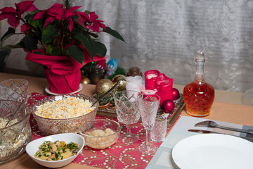 Laid table, salad Olivier, traditional Russian dish for New Year
