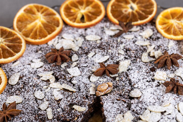 Tart with poppy seeds and fruit sprinkled with powdered sugar