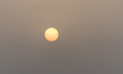 Sun Shining through Smoke from a Forest Fire
