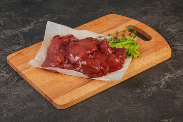 Raw chicken liver over board