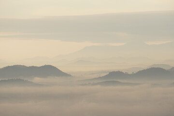 Landscape mountain with fog in the morning at Phu thok at chiang khan loei thailand - soft white nature scene abstract 