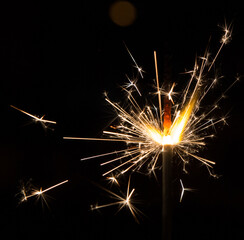 Obraz premium Bengal fire sparkles isolated on black background
