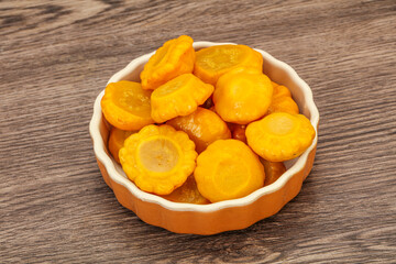 Marinated yellow patisson in the bowl