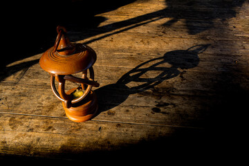 The shadow of a wooden lantern