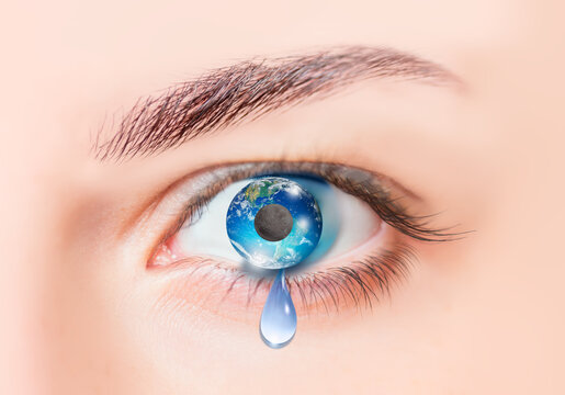 Planet earth in girl's eye with dark side of the moon "Elements of this image furnished by NASA"