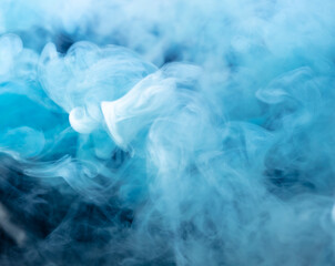 Blue smoke isolated on black background.