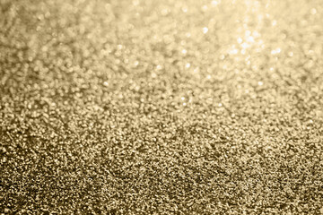 Abstract gold glitter sparkle blurred with bokeh background