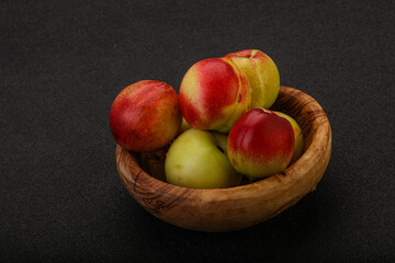 Sweet small nectarines in the basket