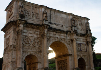 Fototapeta na wymiar Arch of Constantine ( Arco di Costantino ) , A 21m-high Roman structure made up of 3 arches decorated with figures and battle scenes.Rome,Italy.