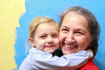 Closeup summer portrait of happy grandmother with granddaughter