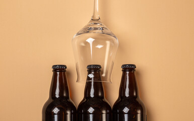 full beer bottles and 
beer glass on a monotone background